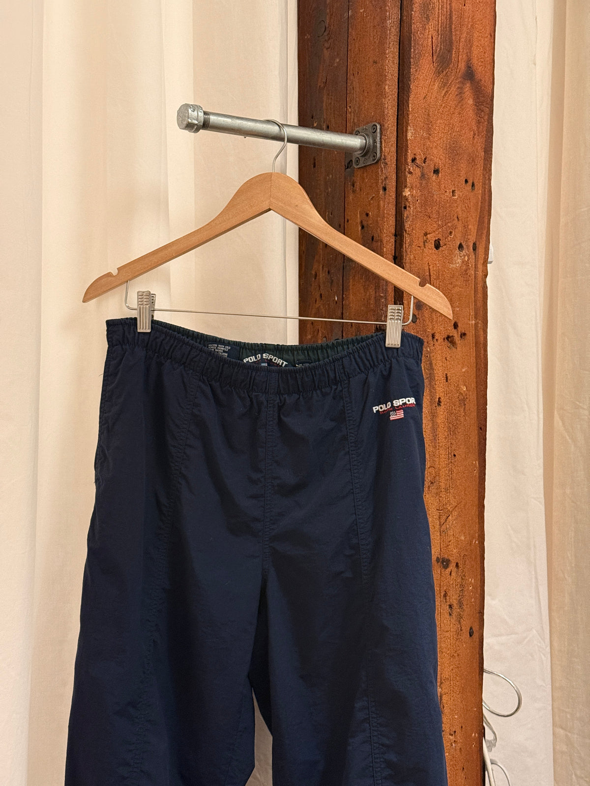 Vintage navy nylon logo track pants by Polo Sport Ralph Lauren (M) (1990s)
